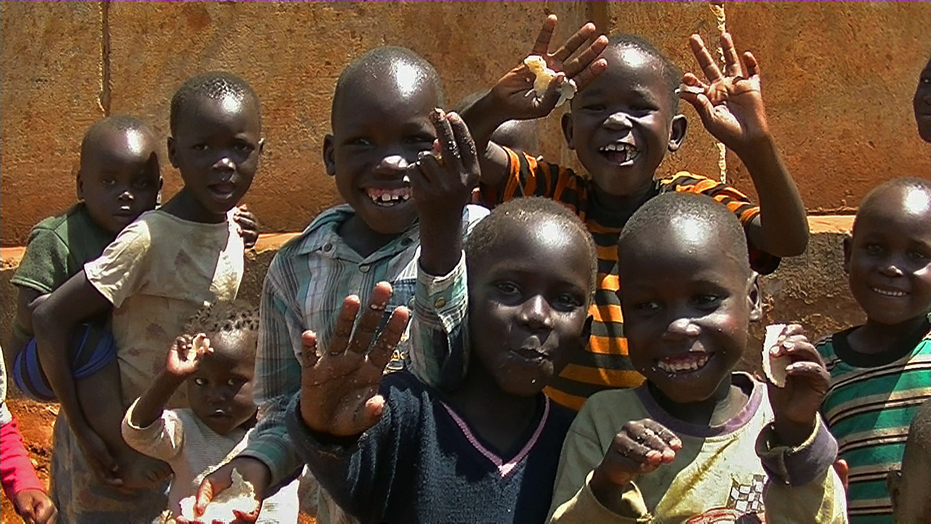 Children laughing eating bread